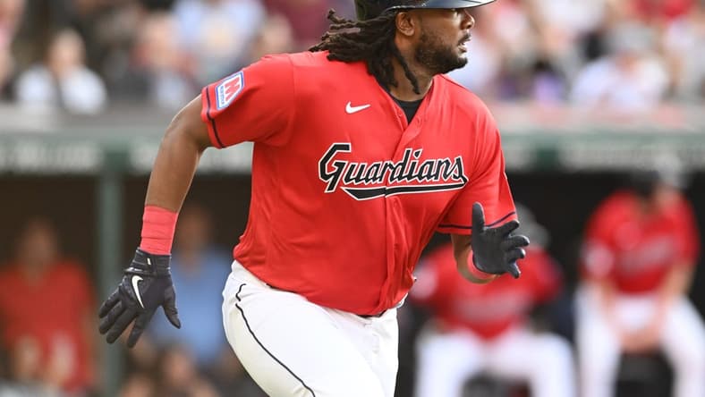 Jul 21, 2023; Cleveland, Ohio, USA; Cleveland Guardians designated hitter Josh Bell (55) hits an RBI double during the first inning against the Philadelphia Phillies at Progressive Field. Mandatory Credit: Ken Blaze-USA TODAY Sports