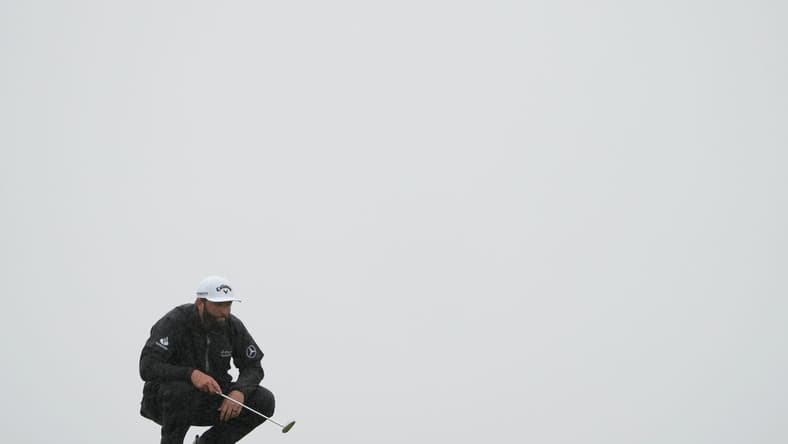 Jul 23, 2023; Hoylake, England, GBR; Jon Rahm lines up a putt on the 13th green during the final round of The Open Championship golf tournament. Mandatory Credit: Kyle Terada-USA TODAY Sports
