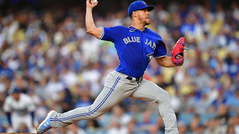 Jul 24, 2023; Los Angeles, California, USA; Toronto Blue Jays starting pitcher Jose Berrios (17) throws against the Los Angeles Dodgers during the first inning at Dodger Stadium. Mandatory Credit: Gary A. Vasquez-USA TODAY Sports