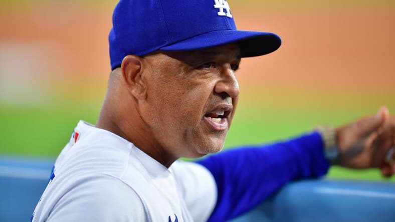 Jul 24, 2023; Los Angeles, California, USA; Los Angeles Dodgers manager Dave Roberts (30) watches game action against the Toronto Blue Jays during the fourth inning at Dodger Stadium. Mandatory Credit: Gary A. Vasquez-USA TODAY Sports