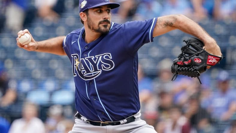 Jul 16, 2023; Kansas City, Missouri, USA; Tampa Bay Rays starting pitcher Zach Eflin (24) delivers a pitch against the Kansas City Royals prior to a game at Kauffman Stadium. Mandatory Credit: Denny Medley-USA TODAY Sports