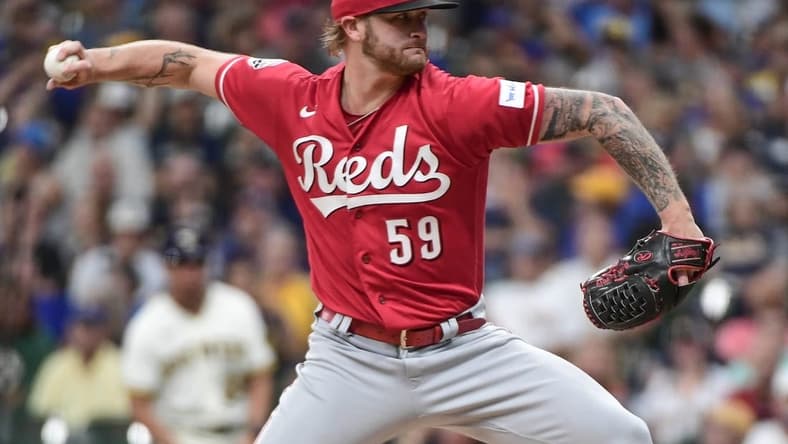 Jul 26, 2023; Milwaukee, Wisconsin, USA; Cincinnati Reds starting pitcher Ben Lively (59) pitches against the Milwaukee Brewers in the first inning at American Family Field. Mandatory Credit: Benny Sieu-USA TODAY Sports