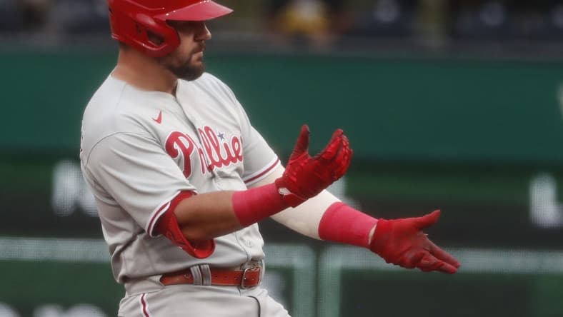 Jul 28, 2023; Pittsburgh, Pennsylvania, USA;  Philadelphia Phillies designated hitter Kyle Schwarber (12) reacts at second base after hitting a double against the Pittsburgh Pirates during the first inning at PNC Park. Mandatory Credit: Charles LeClaire-USA TODAY Sports