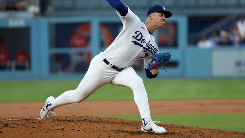 Jul 28, 2023; Los Angeles, California, USA;  Los Angeles Dodgers starting pitcher Bobby Miller (70) pitches during the second inning against the Cincinnati Reds at Dodger Stadium. Mandatory Credit: Kiyoshi Mio-USA TODAY Sports