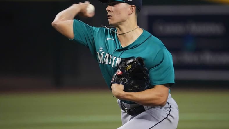 Jul 29, 2023; Phoenix, Arizona, USA; Seattle Mariners starting pitcher Bryan Woo (33) pitches against the Arizona Diamondbacks during the first inning at Chase Field. Mandatory Credit: Joe Camporeale-USA TODAY Sports