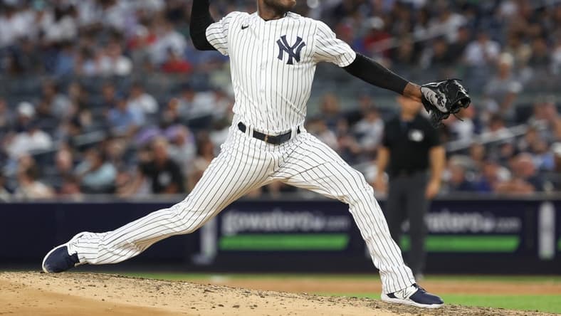 Jul 31, 2023; Bronx, New York, USA; New York Yankees starting pitcher Domingo German (0) delivers a pitch during the seventh inning against the Tampa Bay Rays at Yankee Stadium. Mandatory Credit: Vincent Carchietta-USA TODAY Sports