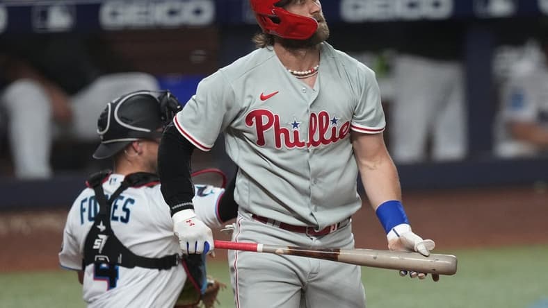 Jul 31, 2023; Miami, Florida, USA; Philadelphia Phillies designated hitter Bryce Harper (3) strikes out against the Miami Marlins in the fifth inning at loanDepot Park. Mandatory Credit: Jim Rassol-USA TODAY Sports