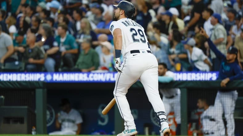 Jul 31, 2023; Seattle, Washington, USA; Seattle Mariners catcher Cal Raleigh (29) hits a solo home run against the Boston Red Sox during the seventh inning at T-Mobile Park. Mandatory Credit: Joe Nicholson-USA TODAY Sports