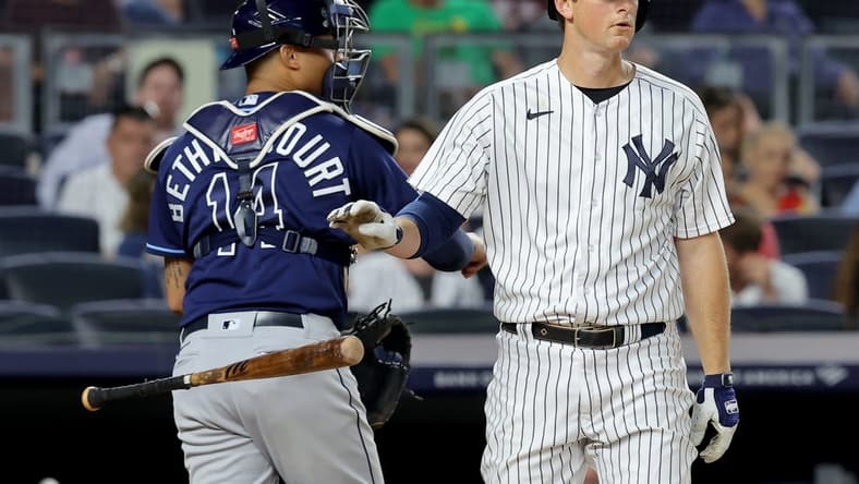 Aug 1, 2023; Bronx, New York, USA; New York Yankees third baseman DJ LeMahieu (26) reacts after striking out to end the seventh inning against the Tampa Bay Rays at Yankee Stadium. Mandatory Credit: Brad Penner-USA TODAY Sports