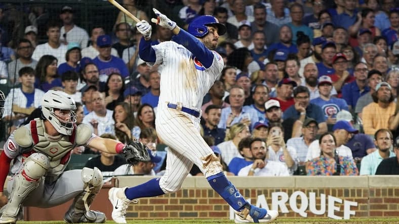 Aug 1, 2023; Chicago, Illinois, USA; Chicago Cubs right fielder Mike Tauchman (40) hits a three-run homer against the Cincinnati Reds during the third inning at Wrigley Field. Mandatory Credit: David Banks-USA TODAY Sports