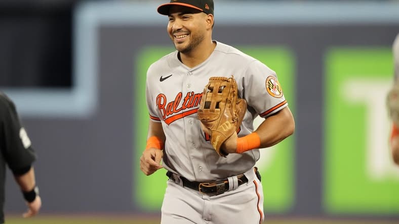 Aug 1, 2023; Toronto, Ontario, CAN; Baltimore Orioles right fielder Anthony Santander (25) reacts as he comes off the field after making a fly ball catch on Toronto Blue Jays shortstop Santiago Espinal (not pictured) during the seventh inning at Rogers Centre. Mandatory Credit: John E. Sokolowski-USA TODAY Sports