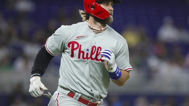 Aug 1, 2023; Miami, Florida, USA; Philadelphia Phillies first baseman Bryce Harper (3) runs toward first base after hitting a single against the Miami Marlins during the fourth inning at loanDepot Park. Mandatory Credit: Sam Navarro-USA TODAY Sports