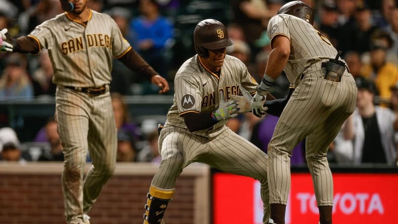 Aug 1, 2023; Denver, Colorado, USA; San Diego Padres left fielder Juan Soto (22) celebrates his three run home run with right fielder Fernando Tatis Jr. (23) in the fifth inning against the Colorado Rockies at Coors Field. Mandatory Credit: Isaiah J. Downing-USA TODAY Sports
