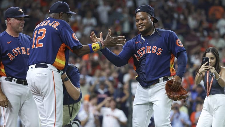 Aug 1, 2023; Houston, Texas, USA; Houston Astros starting pitcher Framber Valdez (59) celebrates with manager Dusty Baker Jr. (12) after pitching a no-hitter against the Cleveland Guardians at Minute Maid Park. Mandatory Credit: Troy Taormina-USA TODAY Sports