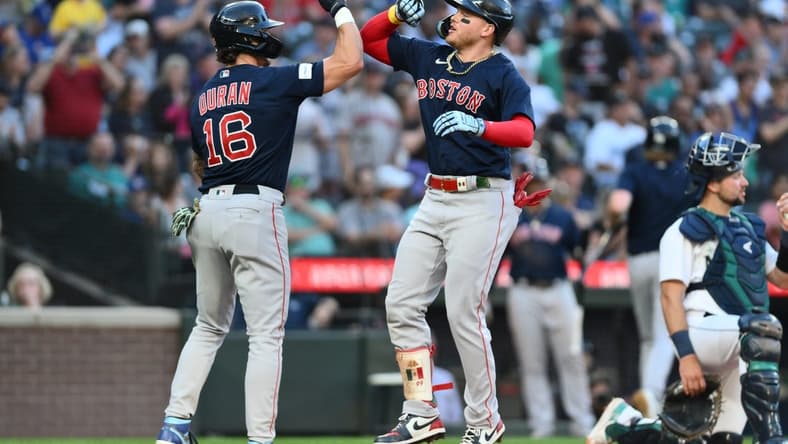 Aug 1, 2023; Seattle, Washington, USA; Boston Red Sox center fielder Jarren Duran (16) and designated hitter Alex Verdugo (99) celebrate after Verdugo hit a two run home run against the Seattle Mariners during the fifth inning at T-Mobile Park. Mandatory Credit: Steven Bisig-USA TODAY Sports