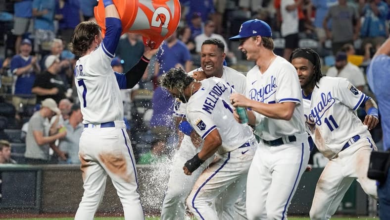 Aug 1, 2023; Kansas City, Missouri, USA; Kansas City Royals right fielder MJ Melendez (1) is doused by shortstop Bobby Witt Jr. (7) after scoring the game winning run against the New York Mets on a walk off balk in the tenth inning at Kauffman Stadium. Mandatory Credit: Denny Medley-USA TODAY Sports
