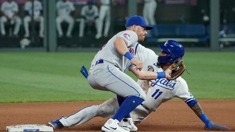 Aug 1, 2023; Kansas City, Missouri, USA; New York Mets second baseman Danny Mendick (15) attempts to make the tag as Kansas City Royals third baseman Maikel Garcia (11) steals second base in the seventh inning at Kauffman Stadium. Mandatory Credit: Denny Medley-USA TODAY Sports