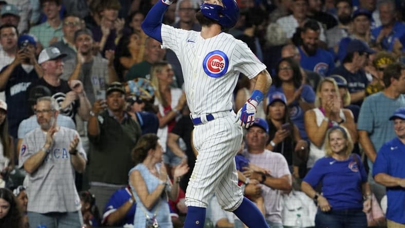 Aug 1, 2023; Chicago, Illinois, USA; Chicago Cubs shortstop Dansby Swanson (7) gestures after hitting a two-run homer against the Cincinnati Reds during the fourth inning at Wrigley Field. Mandatory Credit: David Banks-USA TODAY Sports