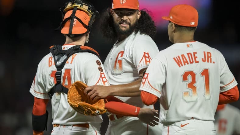 Aug 1, 2023; San Francisco, California, USA;  San Francisco Giants relief pitcher Sean Manaea (52) celebrates with catcher Patrick Bailey (14) and first baseman LaMonte Wade Jr. (31) after a win against the Arizona Diamondbacks at Oracle Park. Mandatory Credit: John Hefti-USA TODAY Sports