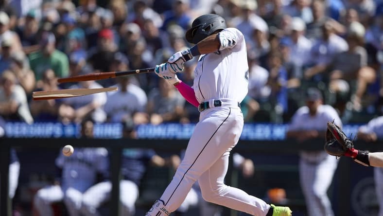Aug 2, 2023; Seattle, Washington, USA; Seattle Mariners  Julio Rodriguez breaks his bat hitting an RBI single against the Boston Red Sox suring the seventh inning at T-Mobile Park. Mandatory Credit: John Froschauer-USA TODAY Sports