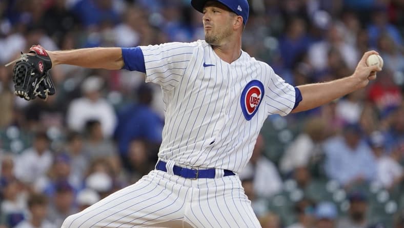 Aug 2, 2023; Chicago, Illinois, USA; Chicago Cubs starting pitcher Drew Smyly (11) throws the ball against the Cincinnati Reds during the first inning at Wrigley Field. Mandatory Credit: David Banks-USA TODAY Sports