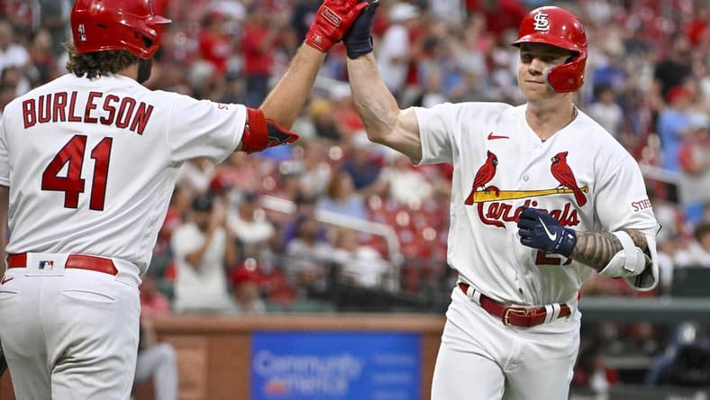 Aug 2, 2023; St. Louis, Missouri, USA;  St. Louis Cardinals left fielder Tyler O'Neill (27) is congratulated by designated hitter Alec Burleson (41) after hitting a solo home run against the Minnesota Twins during the second inning at Busch Stadium. Mandatory Credit: Jeff Curry-USA TODAY Sports