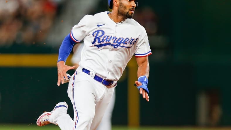 Aug 2, 2023; Arlington, Texas, USA; Texas Rangers second baseman Marcus Semien (2) heads to third base during the second inning against the Chicago White Sox at Globe Life Field. Mandatory Credit: Andrew Dieb-USA TODAY Sports
