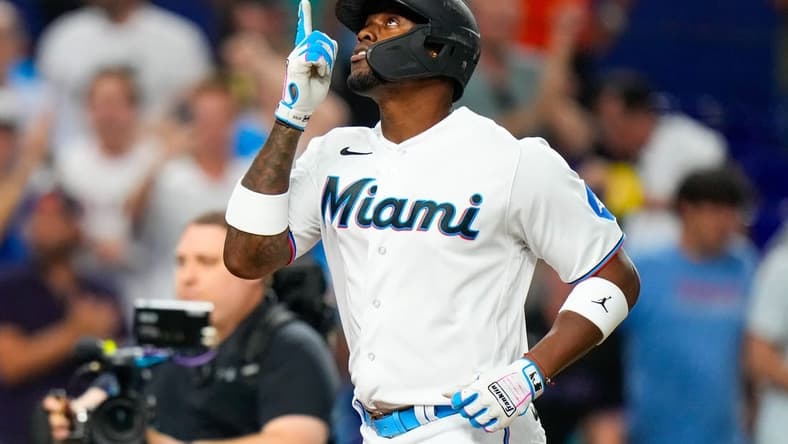 Aug 2, 2023; Miami, Florida, USA; Miami Marlins designated hitter Jorge Soler (12) celebrates hitting a home run against the Philadelphia Phillies during the ninth inning at loanDepot Park. Mandatory Credit: Rich Storry-USA TODAY Sports