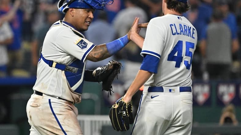 Aug 2, 2023; Kansas City, Missouri, USA;  Kansas City Royals catcher Salvador Perez (13) celebrates with relief pitcher Taylor Clarke (45) after the final out against the New York Mets at Kauffman Stadium. Mandatory Credit: Peter Aiken-USA TODAY Sports