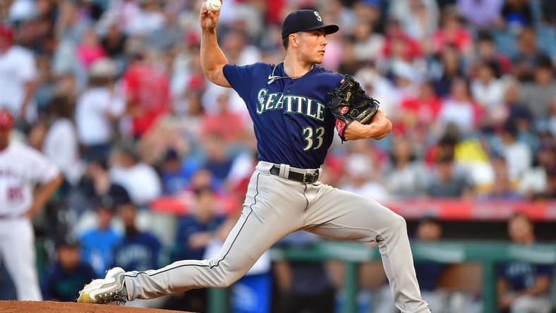 August 3, 2023; Anaheim, California, USA; Seattle Mariners starting pitcher Bryan Woo (33) throws against the Los Angeles Angels during the first inning at Angel Stadium. Mandatory Credit: Gary A. Vasquez-USA TODAY Sports