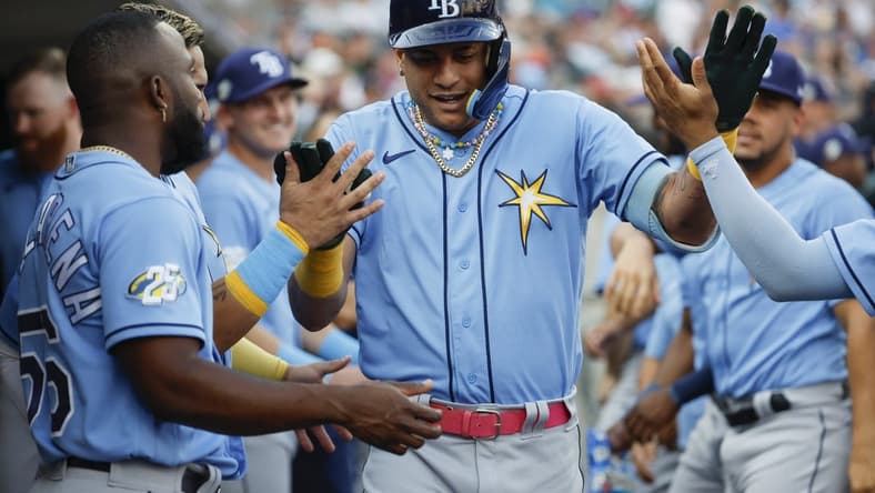 Aug 4, 2023; Detroit, Michigan, USA;  Tampa Bay Rays center fielder Jose Siri (22) is greeted after he hits a two run home run in the second inning against the Detroit Tigers at Comerica Park. Mandatory Credit: Rick Osentoski-USA TODAY Sports