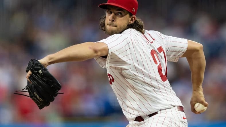 Aug 4, 2023; Philadelphia, Pennsylvania, USA; Philadelphia Phillies starting pitcher Aaron Nola (27) throws a pitch during the third inning against the Kansas City Royals at Citizens Bank Park. Mandatory Credit: Bill Streicher-USA TODAY Sports