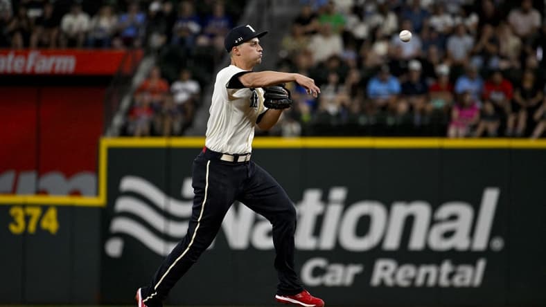 Aug 4, 2023; Arlington, Texas, USA; Texas Rangers shortstop Corey Seager (5) throws to first base during the third inning against the Miami Marlins at Globe Life Field. Mandatory Credit: Jerome Miron-USA TODAY Sports