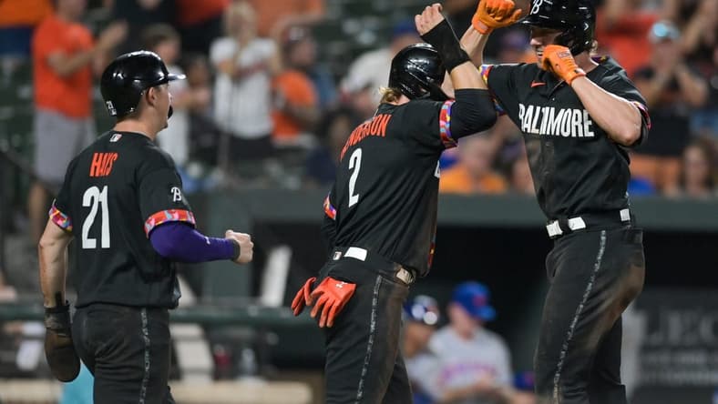 Aug 4, 2023; Baltimore, Maryland, USA; Baltimore Orioles second baseman Jordan Westburg (11) celebrates with third baseman Gunnar Henderson (2) and left fielder Austin Hays (21) after hitting a seventh inning three run home run against the New York Mets at Oriole Park at Camden Yards. Mandatory Credit: Tommy Gilligan-USA TODAY Sports