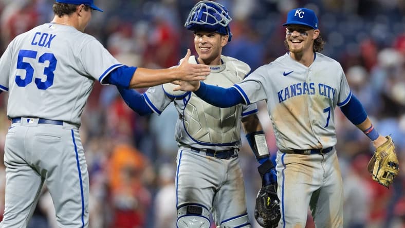 Aug 4, 2023; Philadelphia, Pennsylvania, USA; Kansas City Royals relief pitcher Austin Cox (53) and catcher Freddy Fermin (34) and shortstop Bobby Witt Jr. (7) celebrate a victory against the Philadelphia Phillies at Citizens Bank Park. Mandatory Credit: Bill Streicher-USA TODAY Sports