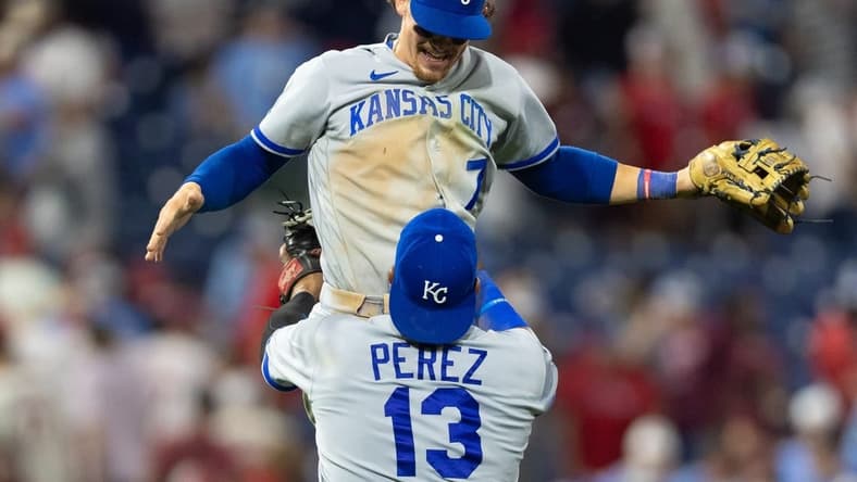 Aug 4, 2023; Philadelphia, Pennsylvania, USA; Kansas City Royals catcher Salvador Perez (13) lifts shortstop Bobby Witt Jr. (7) as they celebrate a victory against the Philadelphia Phillies at Citizens Bank Park. Mandatory Credit: Bill Streicher-USA TODAY Sports