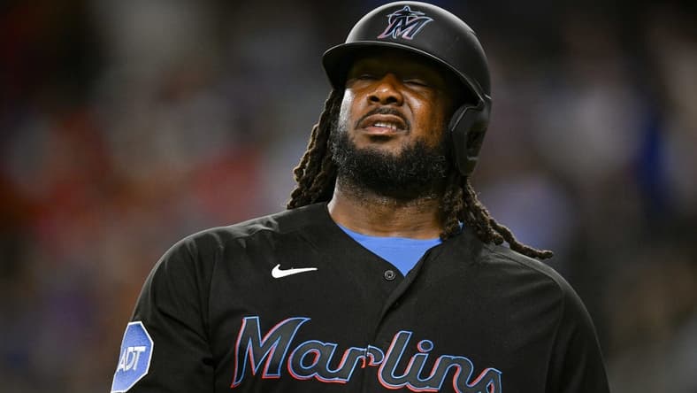 Aug 4, 2023; Arlington, Texas, USA; Miami Marlins designated hitter Josh Bell (9) reacts to striking out against the Texas Rangers during the sixth inning at Globe Life Field. Mandatory Credit: Jerome Miron-USA TODAY Sports