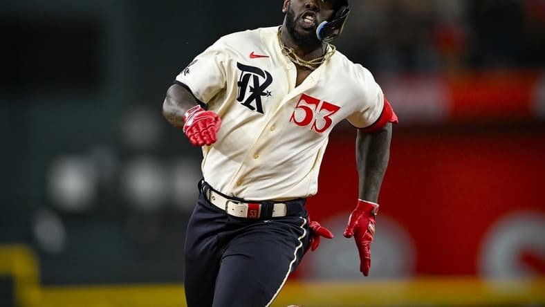 Aug 4, 2023; Arlington, Texas, USA; Texas Rangers right fielder Adolis Garcia (53) runs to third base during the seventh inning against the Miami Marlins at Globe Life Field. Mandatory Credit: Jerome Miron-USA TODAY Sports