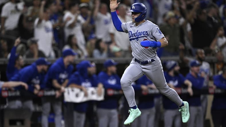 Aug 4, 2023; San Diego, California, USA; Los Angeles Dodgers left fielder Enrique Hernandez (8) scores a run against the San Diego Padres during the eighth inning at Petco Park. Mandatory Credit: Orlando Ramirez-USA TODAY Sports