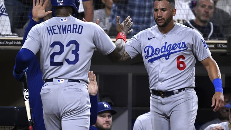 Aug 4, 2023; San Diego, California, USA; Los Angeles Dodgers right fielder Jason Heyward (23) is congratulated by designated hitter David Peralta (6) after scoring a run against the San Diego Padres during the eighth inning at Petco Park. Mandatory Credit: Orlando Ramirez-USA TODAY Sports