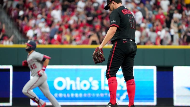 Aug 4, 2023; Cincinnati, Ohio, USA; Cincinnati Reds starting pitcher Graham Ashcraft (51) reacts after giving up a two run home run against Washington Nationals designated hitter Joey Meneses (45) during the eighth inning at Great American Ball Park. Mandatory Credit: Kareem Elgazzar-The Cincinnati Enquirer-USA TODAY Sports