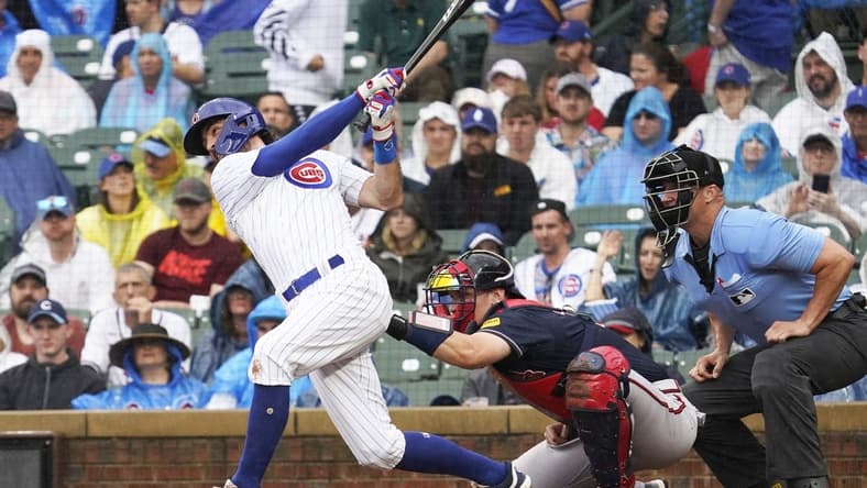 Aug 5, 2023; Chicago, Illinois, USA; Chicago Cubs shortstop Dansby Swanson (7) hits a two-run home run against the Atlanta Braves during the first inning at Wrigley Field. Mandatory Credit: David Banks-USA TODAY Sports