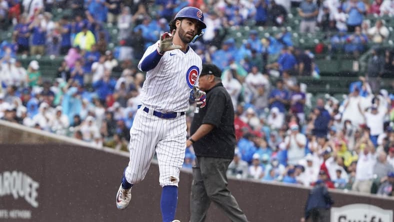 Aug 5, 2023; Chicago, Illinois, USA; Chicago Cubs shortstop Dansby Swanson (7) gestures after hitting a two-run home run against the Atlanta Braves during the first inning at Wrigley Field. Mandatory Credit: David Banks-USA TODAY Sports