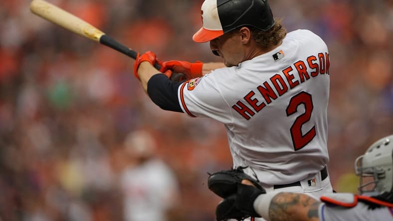 Aug 5, 2023; Baltimore, Maryland, USA; Baltimore Orioles third baseman Gunnar Henderson (2) hits a two run home run against the New York Mets during the first inning at Oriole Park at Camden Yards. Mandatory Credit: Gregory Fisher-USA TODAY Sports