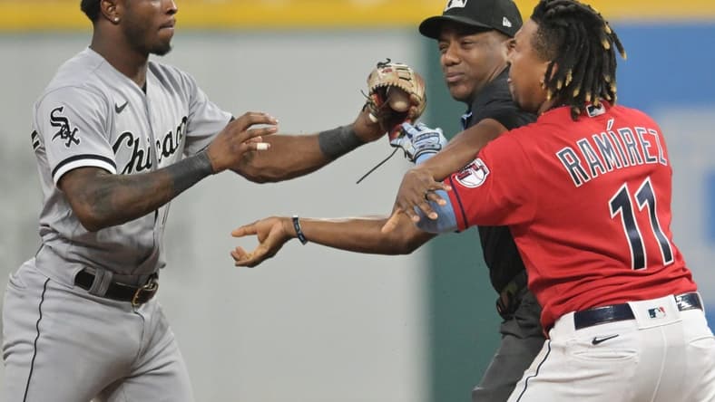 Aug 5, 2023; Cleveland, Ohio, USA; Umpire Malachi Moore tries to separate Cleveland Guardians third baseman Jose Ramirez (11) and Chicago White Sox shortstop Tim Anderson (7) after Ramirez slid into second with an RBI double during the sixth inning at Progressive Field. Mandatory Credit: Ken Blaze-USA TODAY Sports