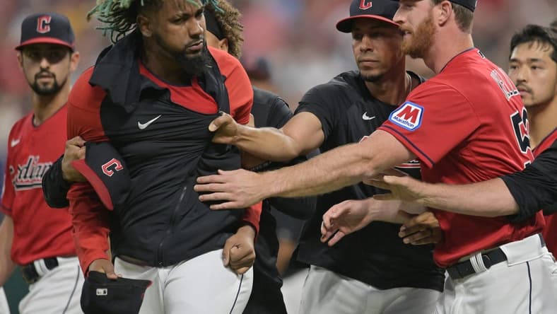 Aug 5, 2023; Cleveland, Ohio, USA; Teammates restrain Cleveland Guardians relief pitcher Emmanuel Clase (48) after a fight during the sixth inning at Progressive Field. Mandatory Credit: Ken Blaze-USA TODAY Sports