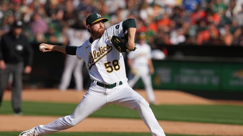 Aug 5, 2023; Oakland, California, USA; Oakland Athletics starting pitcher Paul Blackburn (58) throws a pitch against the San Francisco Giants during the sixth inning at Oakland-Alameda County Coliseum. Mandatory Credit: Darren Yamashita-USA TODAY Sports