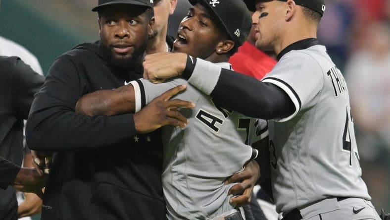 Aug 5, 2023; Cleveland, Ohio, USA; Teammates hold back Chicago White Sox shortstop Tim Anderson (7) after Anderson and Cleveland Guardians third baseman Jose Ramirez (not pictured) got into a fight during the sixth inning at Progressive Field. Mandatory Credit: Ken Blaze-USA TODAY Sports