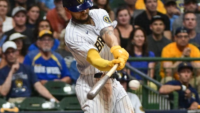 Aug 5, 2023; Milwaukee, Wisconsin, USA;  Milwaukee Brewers right fielder Blake Perkins (16) drives in the winning run with a base hit in the tenth inning against the Pittsburgh Pirates at American Family Field. Mandatory Credit: Benny Sieu-USA TODAY Sports