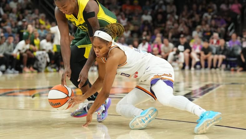 Aug 5, 2023; Phoenix, Arizona, USA; Seattle Storm guard Jewell Loyd (24) and Phoenix Mercury guard Moriah Jefferson (8) go after a loose ball during the second half at Footprint Center. Mandatory Credit: Joe Camporeale-USA TODAY Sports